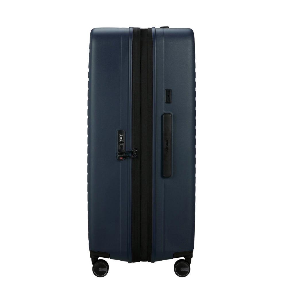 81cm Restackd Spinner Suitcase by Samsonite in midnight blue, showcasing wheels and expandable design for travel convenience.