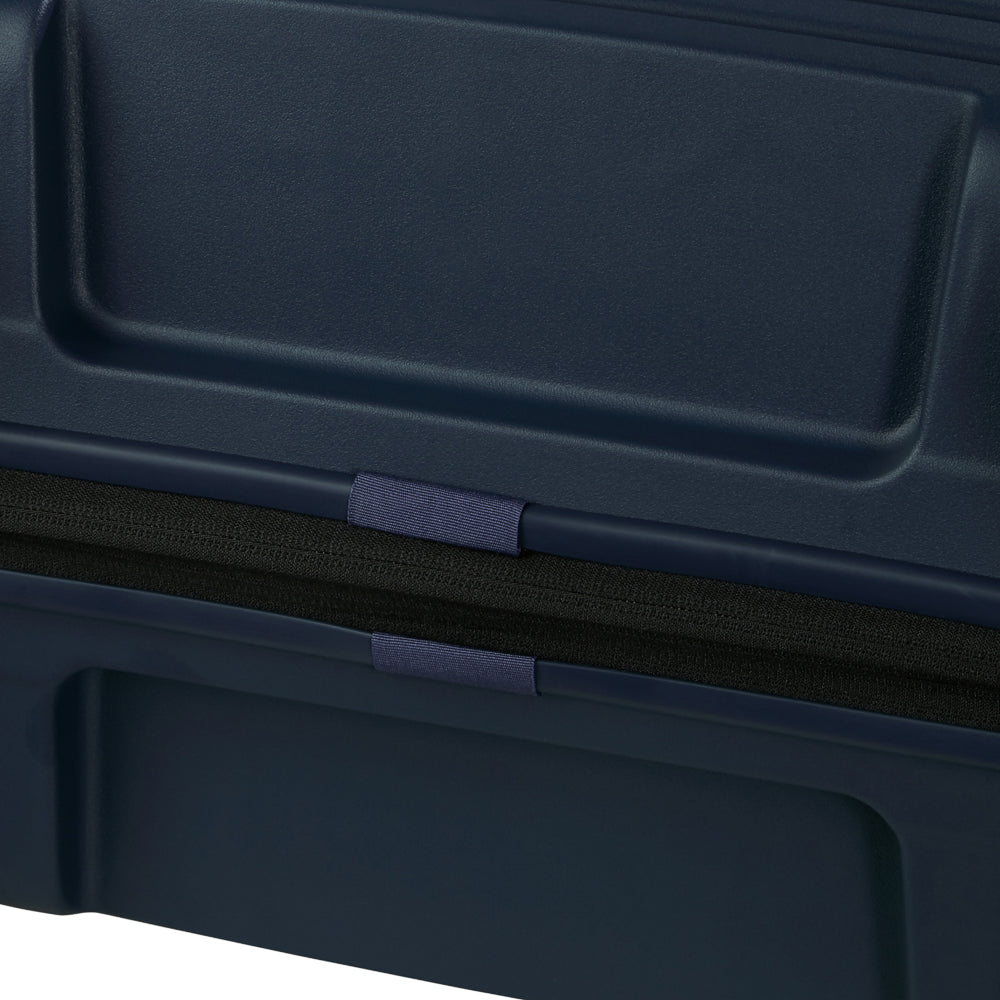 81cm Restackd Spinner Suitcase by Samsonite in midnight blue, showcasing wheels and expandable design for travel convenience.