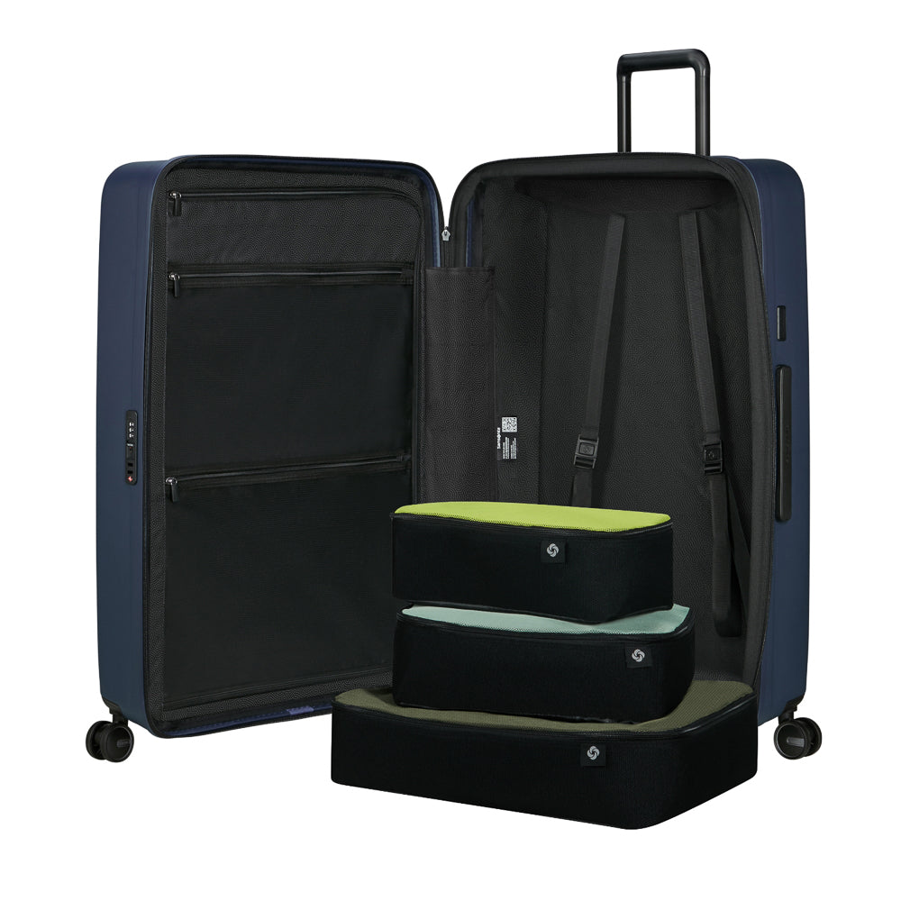 81cm Restackd Spinner Suitcase by Samsonite in midnight blue, showcasing wheels and expandable design for travel convenience.
