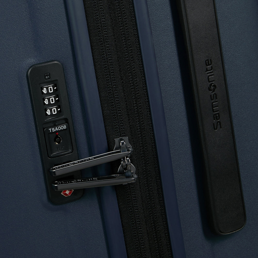 81cm Restackd Spinner Suitcase by Samsonite in midnight blue, showcasing wheels and expandable design for travel convenience.