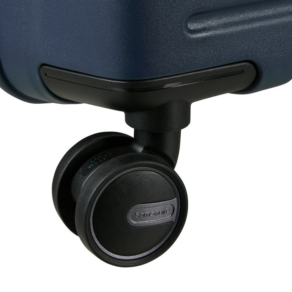 81cm Restackd Spinner Suitcase by Samsonite in midnight blue, showcasing wheels and expandable design for travel convenience.