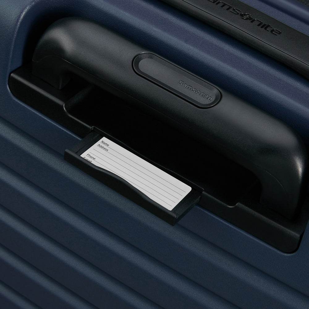 81cm Restackd Spinner Suitcase by Samsonite in midnight blue, showcasing wheels and expandable design for travel convenience.
