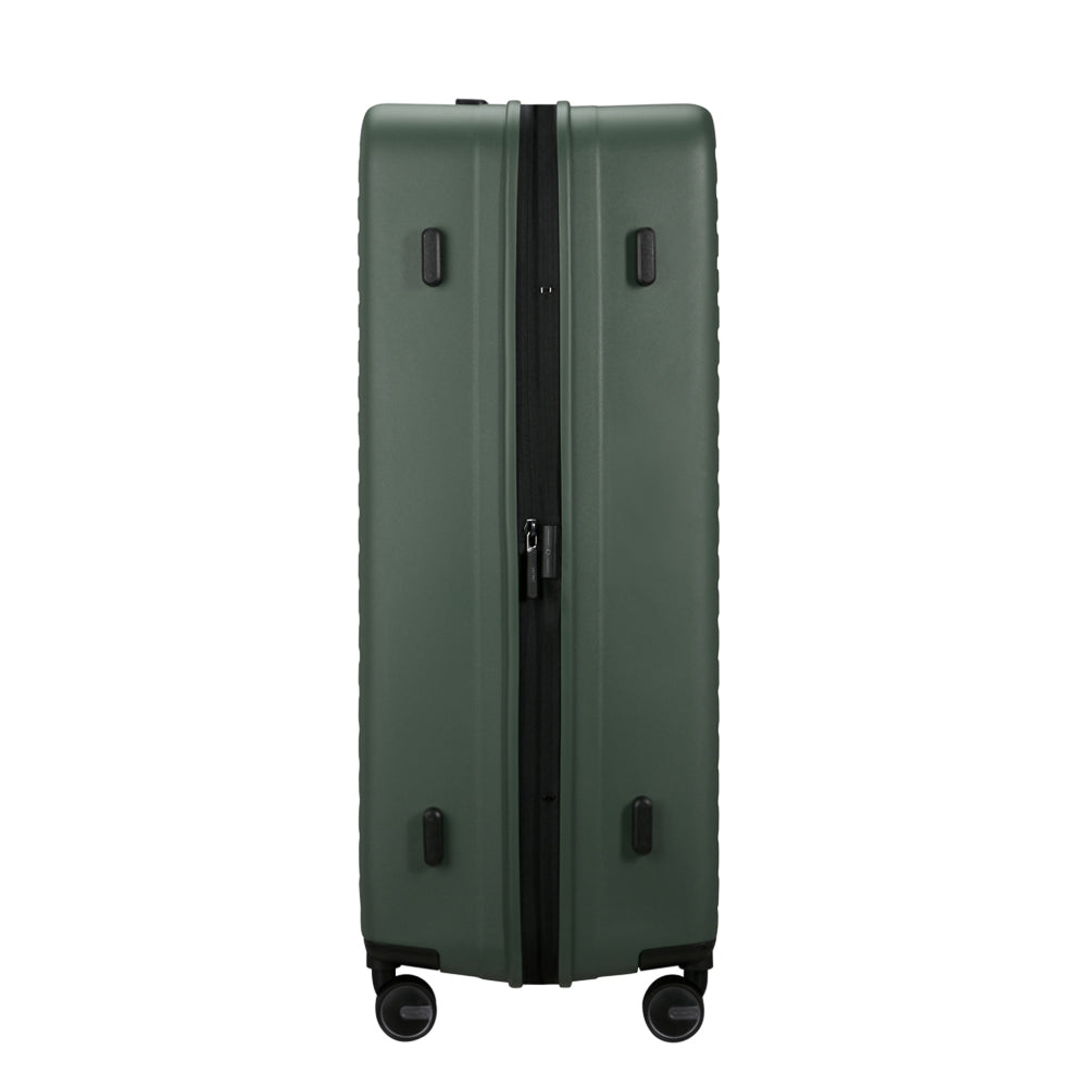 81cm Restackd Spinner Suitcase in sage green, featuring smooth wheels and a durable exterior for easy travel.