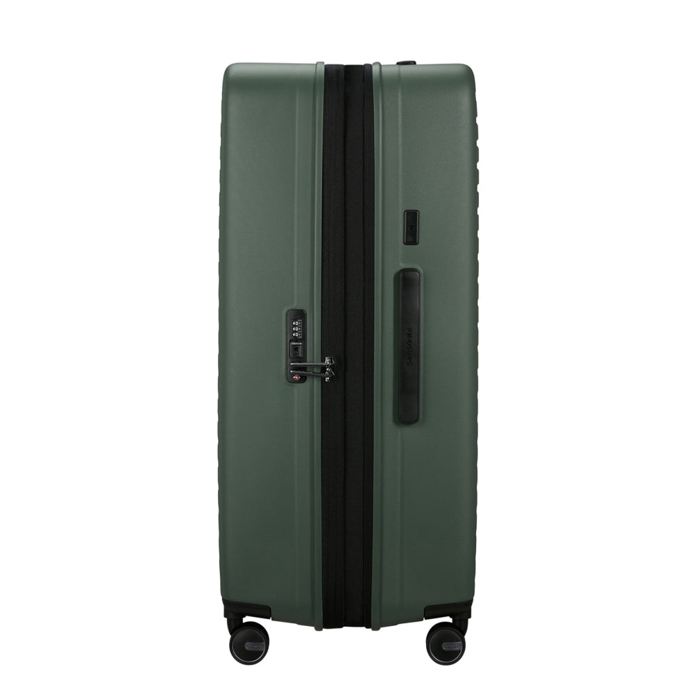 81cm Restackd Spinner Suitcase in sage green, featuring smooth wheels and a durable exterior for easy travel.
