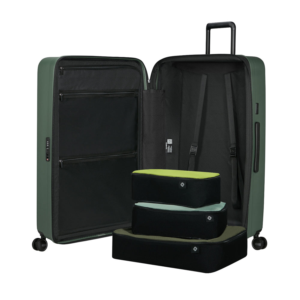 81cm Restackd Spinner Suitcase in sage green, featuring smooth wheels and a durable exterior for easy travel.