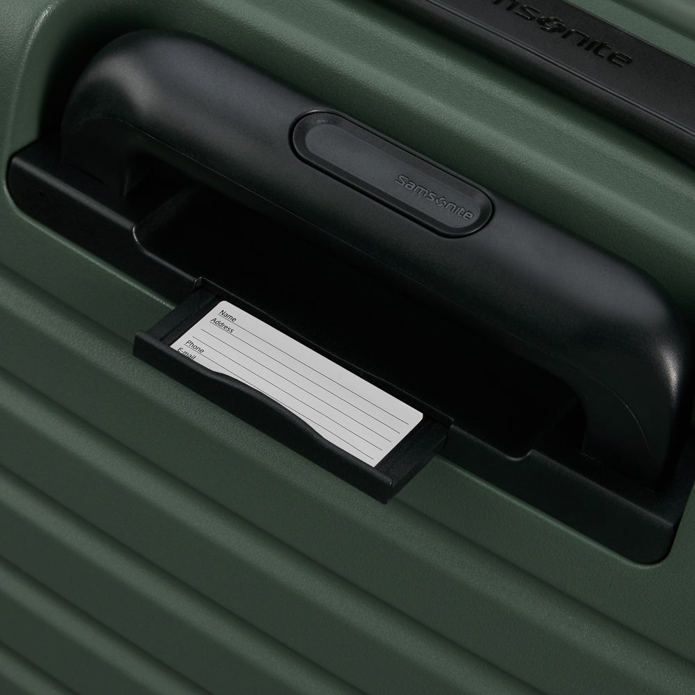 81cm Restackd Spinner Suitcase in sage green, featuring smooth wheels and a durable exterior for easy travel.