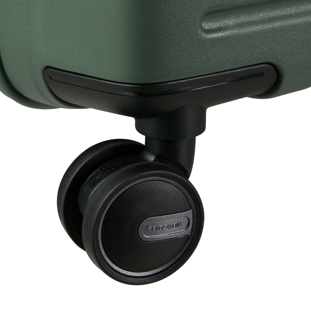 81cm Restackd Spinner Suitcase in sage green, featuring smooth wheels and a durable exterior for easy travel.