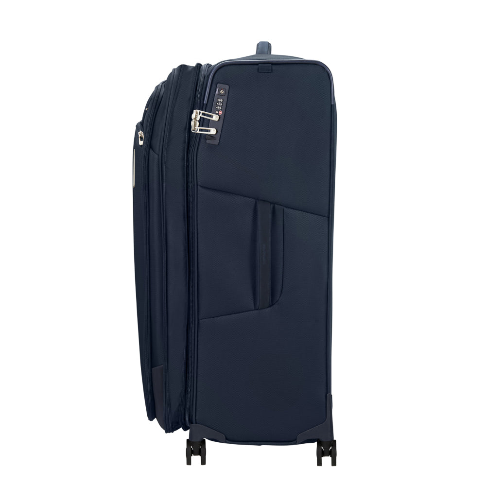 82cm midnight blue Samsonite Respark spinner suitcase with four wheels and a sturdy handle for easy travel.