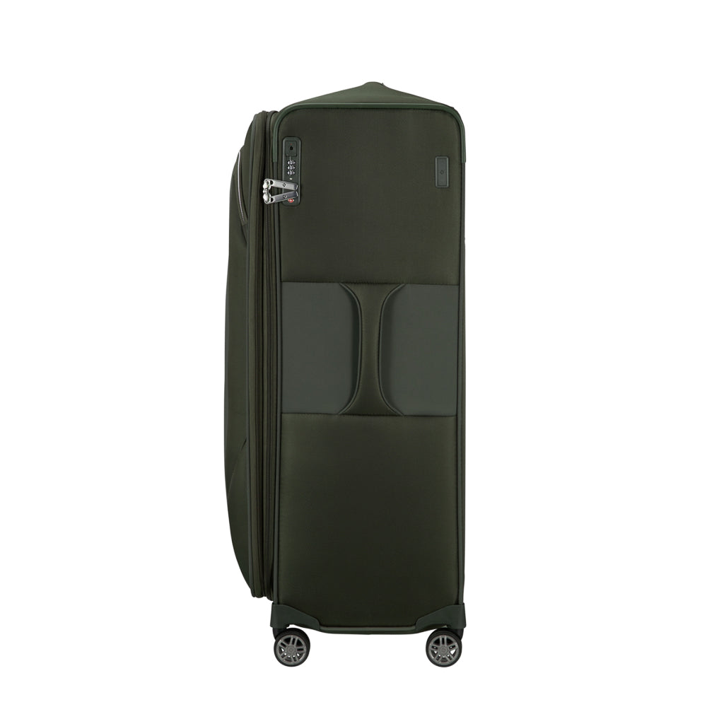Green 83cm Samsonite Re-Lite expandable spinner suitcase with smooth wheels and sturdy handle for easy travel.